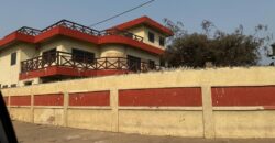 An original 4 bedroom house been partitioned to an 8 bedroom and a penthouse with a 2 bedroom boys quarters for sale Mamprobi