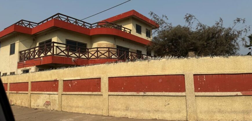 An original 4 bedroom house been partitioned to an 8 bedroom and a penthouse with a 2 bedroom boys quarters for sale Mamprobi