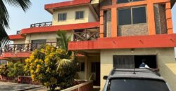 An original 4 bedroom house been partitioned to an 8 bedroom and a penthouse with a 2 bedroom boys quarters for sale Mamprobi