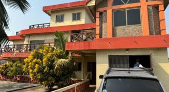 An original 4 bedroom house been partitioned to an 8 bedroom and a penthouse with a 2 bedroom boys quarters for sale Mamprobi