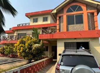 An original 4 bedroom house been partitioned to an 8 bedroom and a penthouse with a 2 bedroom boys quarters for sale Mamprobi