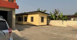 An original 4 bedroom house been partitioned to an 8 bedroom and a penthouse with a 2 bedroom boys quarters for sale Mamprobi