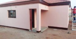 Residential fenced plot with a newly built 2bedrooms bachelor pad holding a title deed in Gakuto village