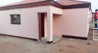 Residential fenced plot with a newly built 2bedrooms bachelor pad holding a title deed in Gakuto village