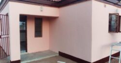 Residential fenced plot with a newly built 2bedrooms bachelor pad holding a title deed in Gakuto village