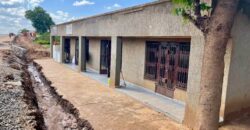 2HOUSES 1 UNFINISHED HOUSE AND 6 SHOPS FOR SALE IN LILONGWE AREA 49 SHIRE ALONG TARMAC ROAD