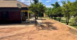 2HOUSES 1 UNFINISHED HOUSE AND 6 SHOPS FOR SALE IN LILONGWE AREA 49 SHIRE ALONG TARMAC ROAD