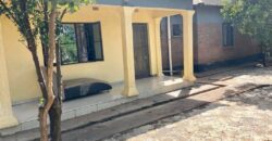 2HOUSES 1 UNFINISHED HOUSE AND 6 SHOPS FOR SALE IN LILONGWE AREA 49 SHIRE ALONG TARMAC ROAD