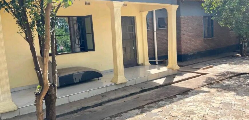 2HOUSES 1 UNFINISHED HOUSE AND 6 SHOPS FOR SALE IN LILONGWE AREA 49 SHIRE ALONG TARMAC ROAD